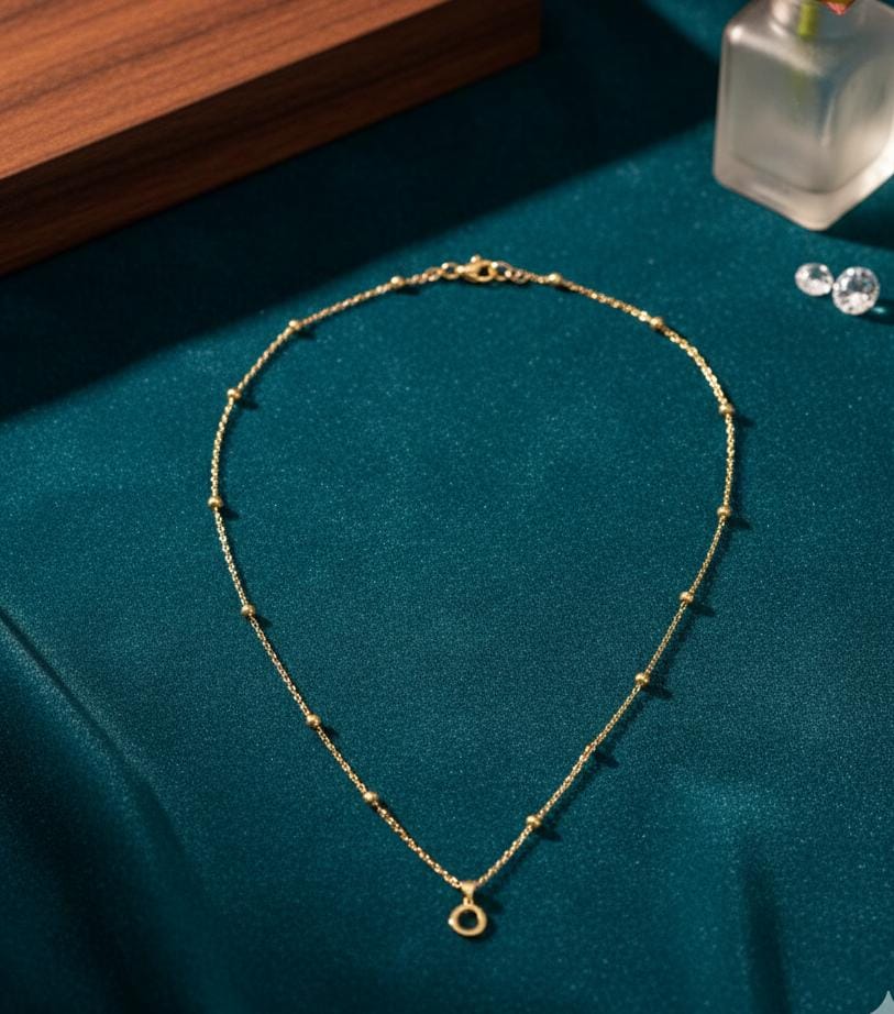 Cadena balines bañados en oro